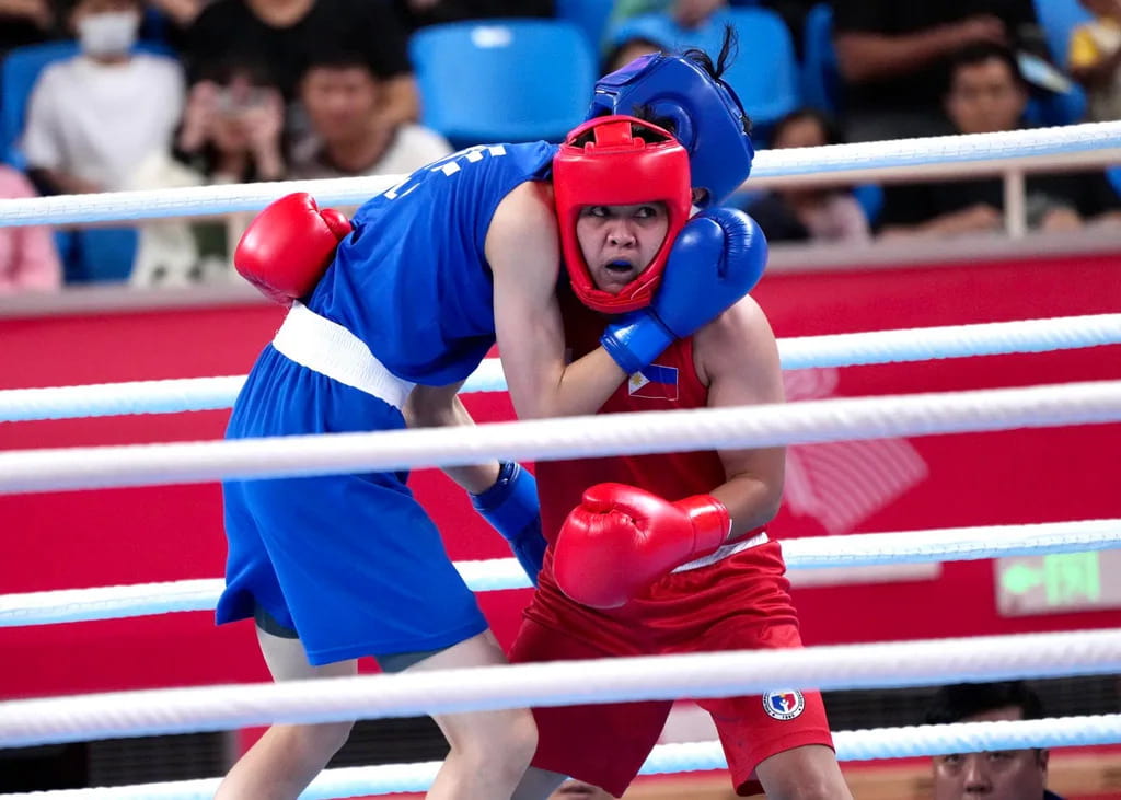 nesthy petecio against Lin Yu Ting of chinese taipei during their bout in the 19th asian games