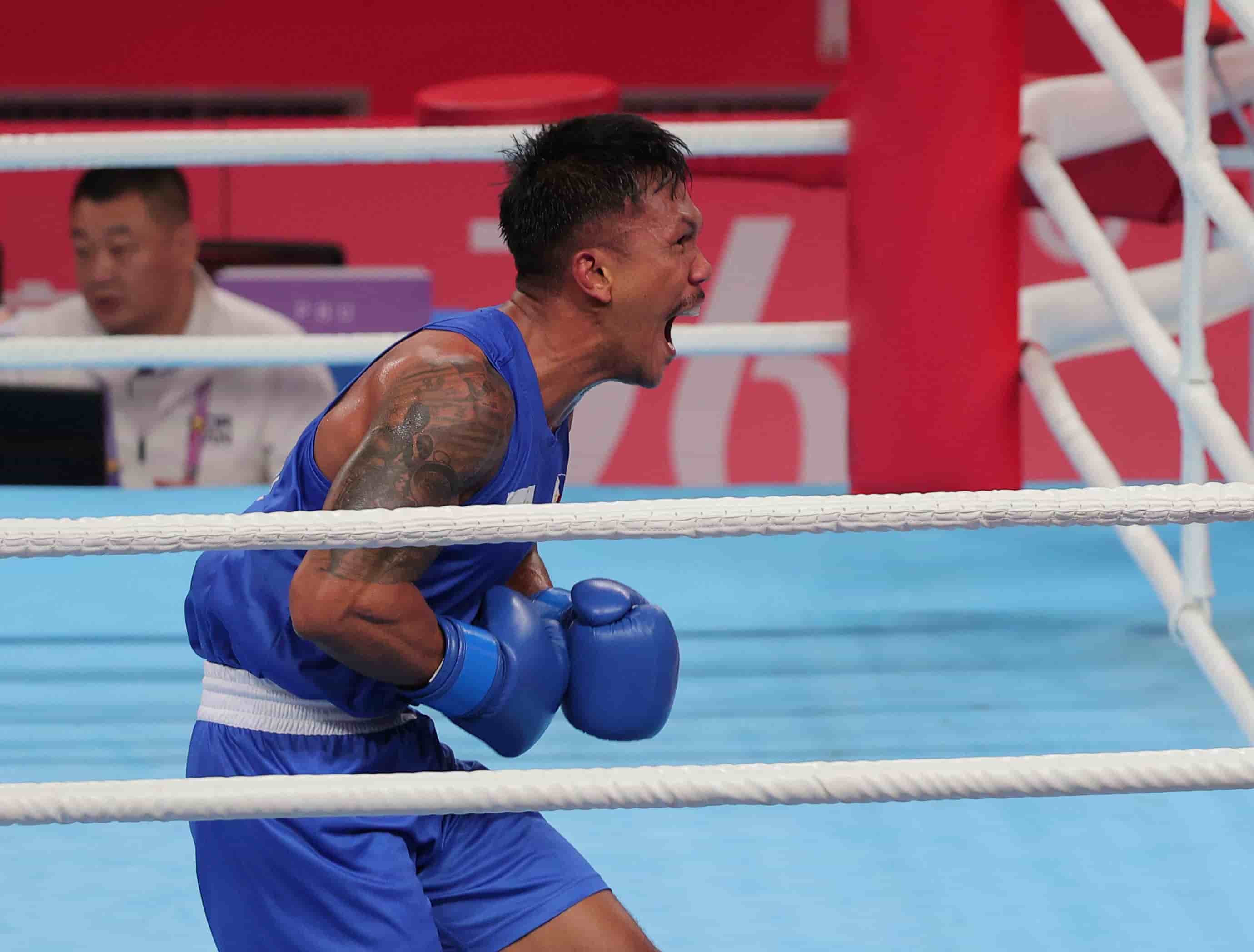 eumir marcial shouted after winning his semifinal match against syria’s ahmad ghousoon in the 19th asian games