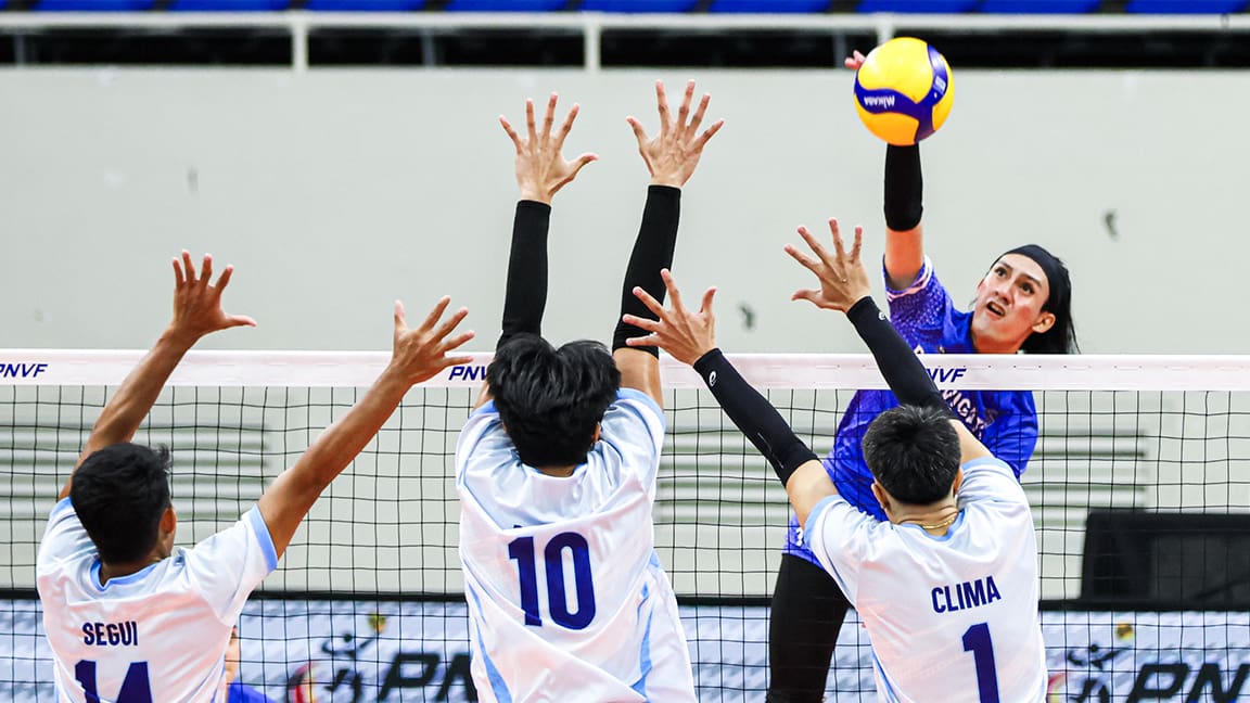 D'Navigators Iloilo's Barbie San Andres against three VNS Asherent Griffins' blockers during their 2024 PNVF Champions League men's division match.