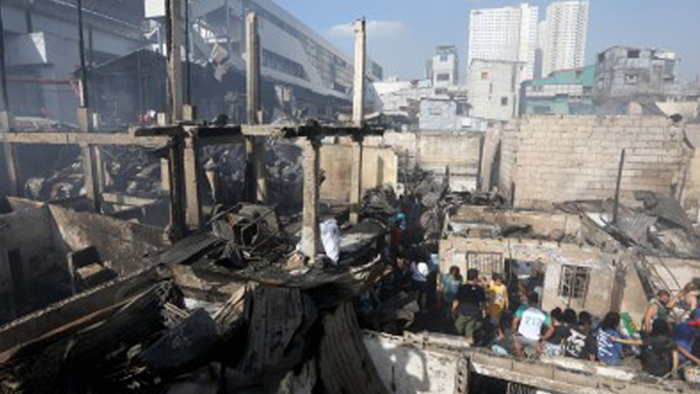 The remnants of 150 houses razed by fire in a residential area along Quezon Boulevard corner Recto Avenue in Manila on Feb. 1, 2024.