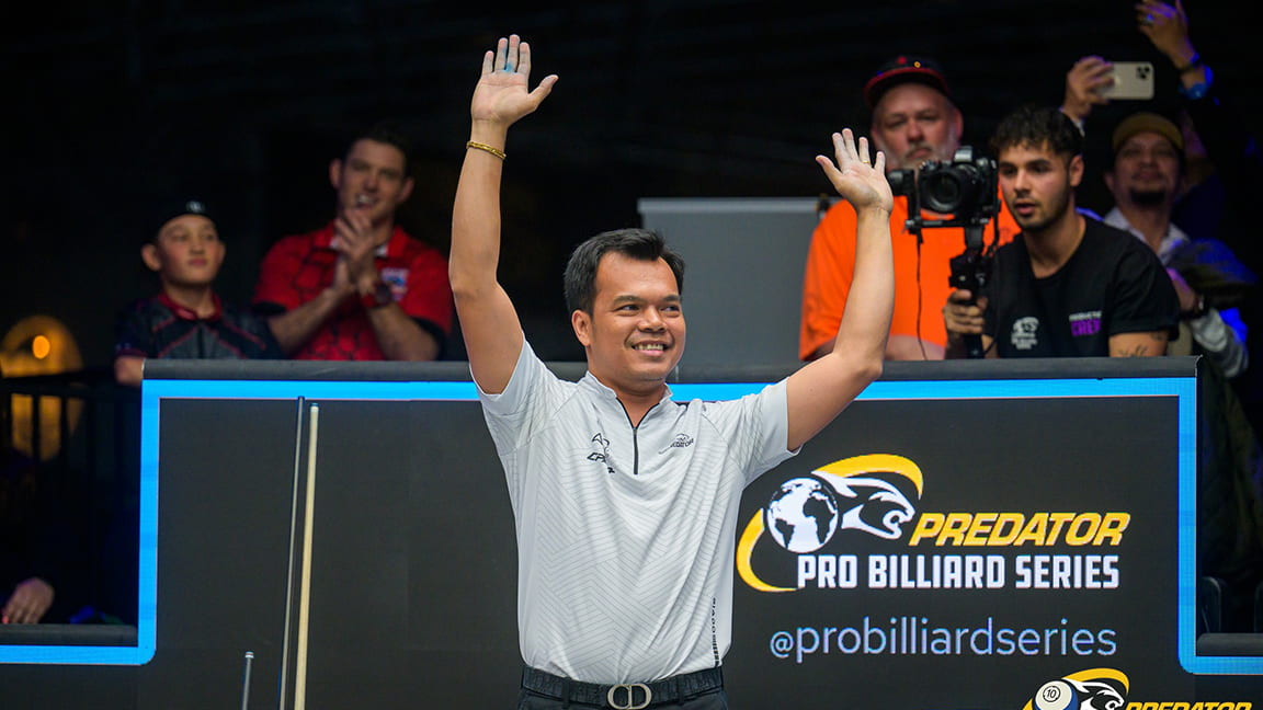 Carlo Biado raising his hands after winning the 2024 Predator WPA Men's World 10-Ball Championship.