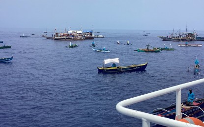 The 'Atin Ito' civilian convoy stopped for a symbolic laying of a marker while on the way to their mission to Bajo de Masinloc in the West Philippine Sea